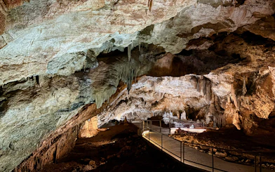 Limestone formations and walkway inside Lipa Cave, Cetinje.
