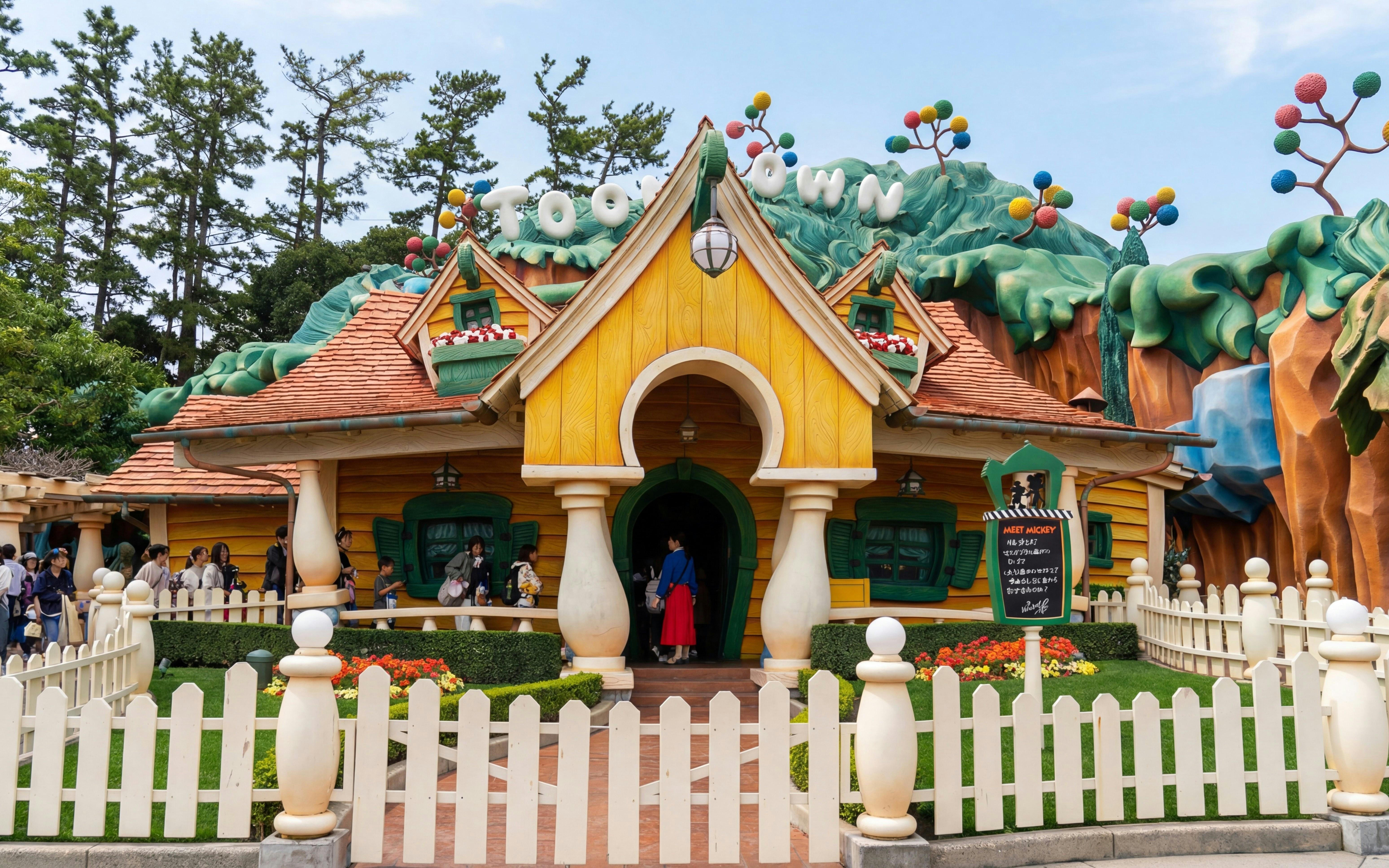 Mickey Mouse's house at Toontown, Disney Resort, Tokyo, Japan, with visitors outside.