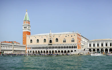Doge's Palace and St. Mark's Campanile viewed from the Grand Canal in Venice.