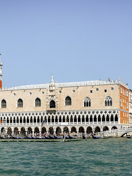 Doge's Palace and St. Mark's Campanile viewed from the Grand Canal in Venice.