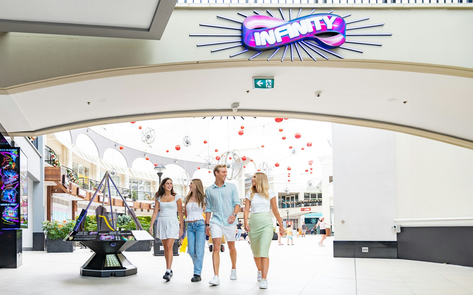 Visitors entering Infinity Attraction at Gold Coast shopping center.