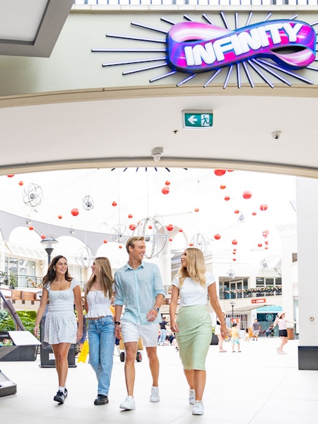 Visitors entering Infinity Attraction at Gold Coast shopping center.