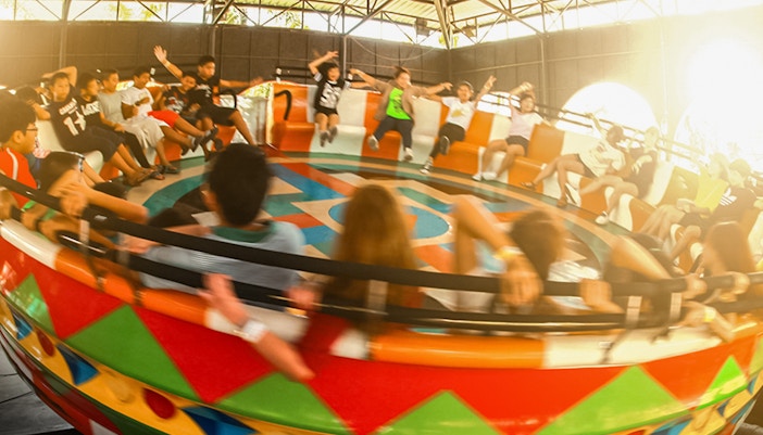 Disco turntable ride at Siam Amazing Park with colorful lights and spinning motion.