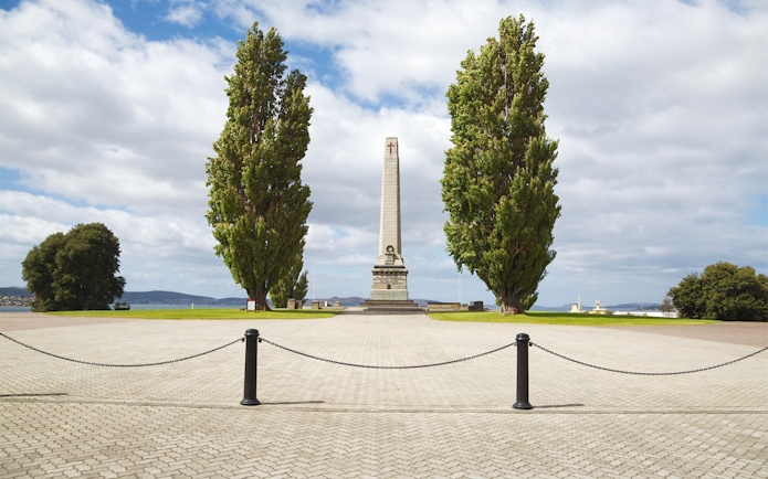 Hobart Cenotaph with tall trees and waterfront view in Tasmania.