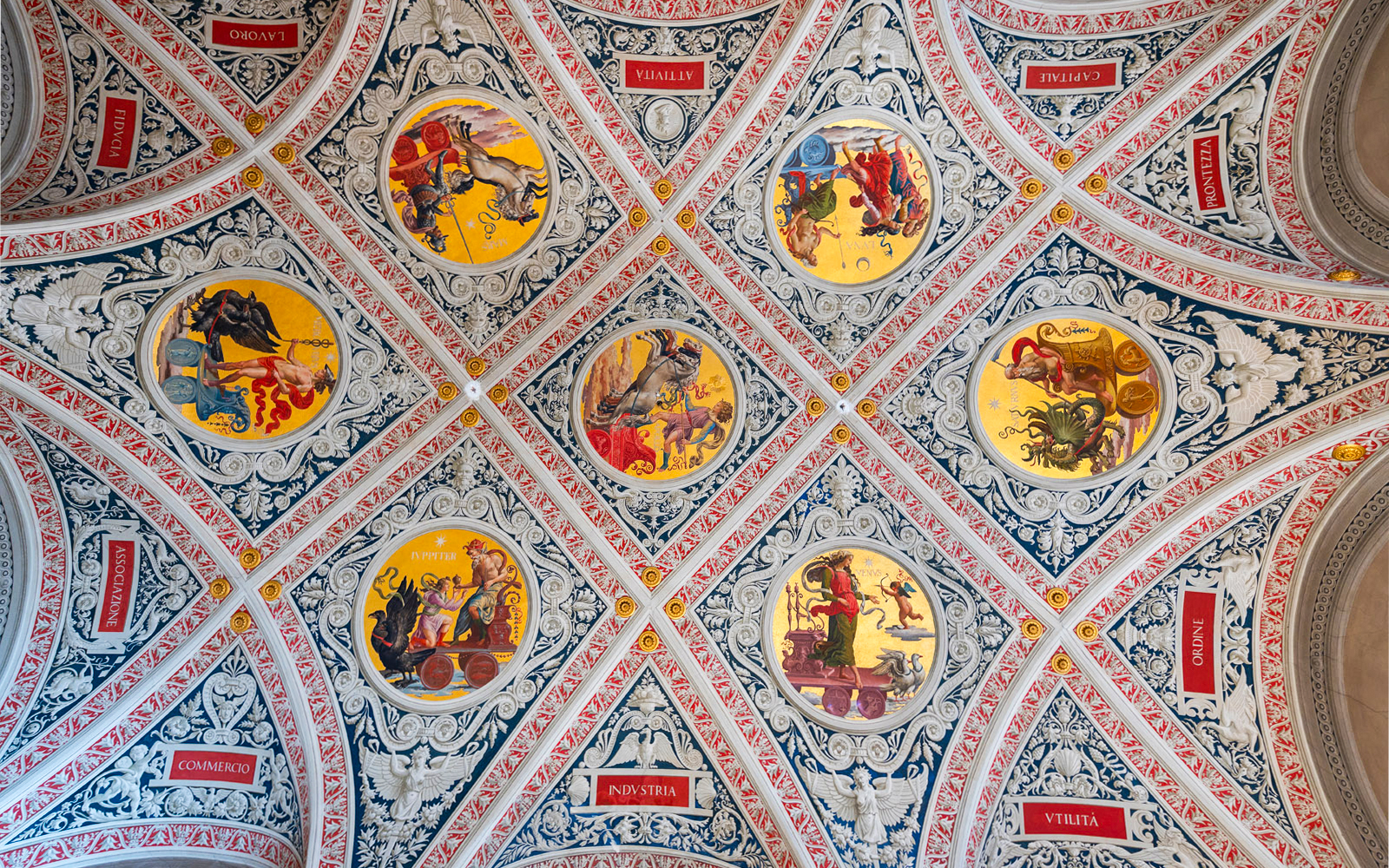 Ceiling frescoes at Palazzo delle Papesse, Siena, featuring intricate circular paintings.