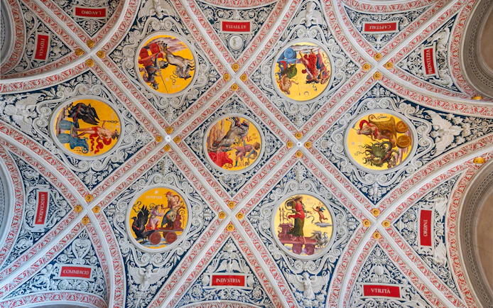 Ceiling frescoes at Palazzo delle Papesse, Siena, featuring intricate circular paintings.