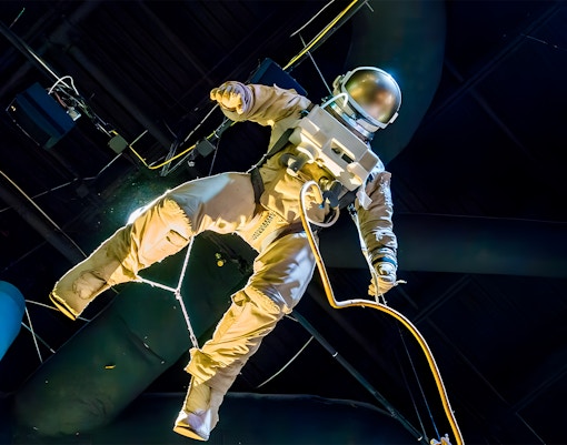 Space suit exhibit with wires connected at Houston Space Center