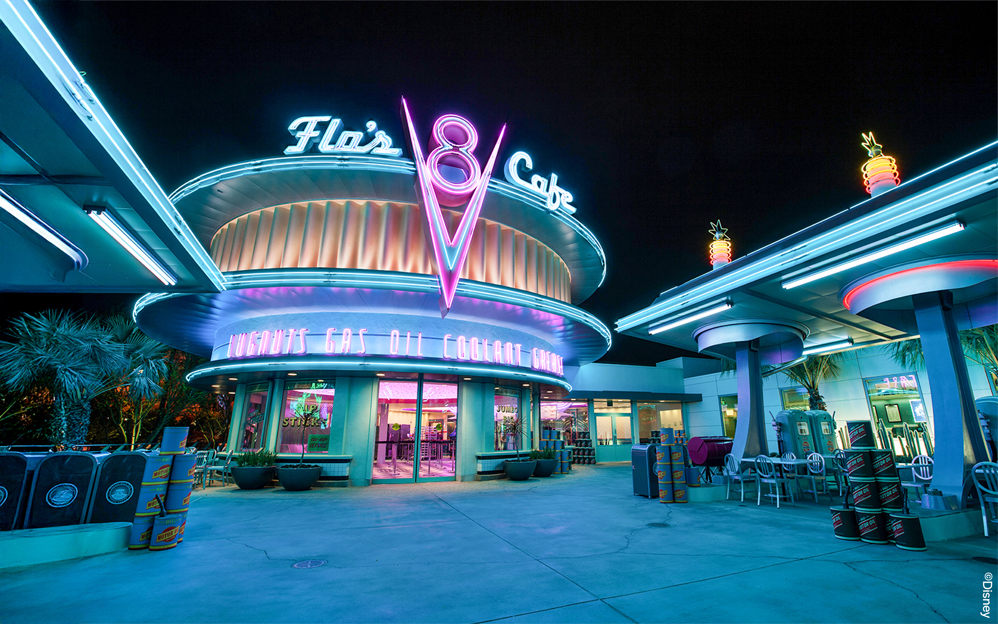 Flo's Cafe neon-lit exterior at Disneyland Adventure Park, California.