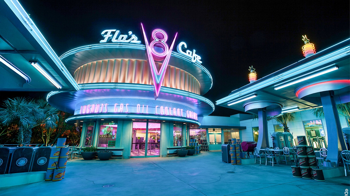 Flo's Cafe neon-lit exterior at Disneyland Adventure Park, California.