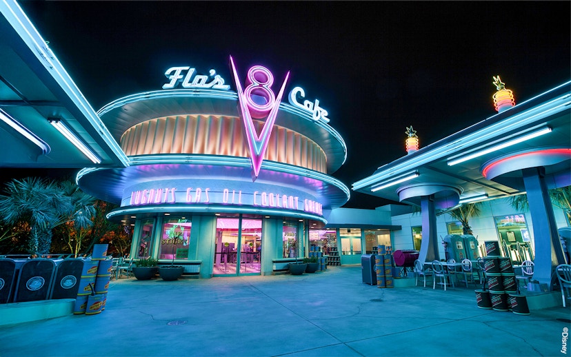 Flo's Cafe neon-lit exterior at Disneyland Adventure Park, California.