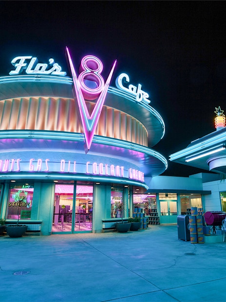 Flo's Cafe neon-lit exterior at Disneyland Adventure Park, California.