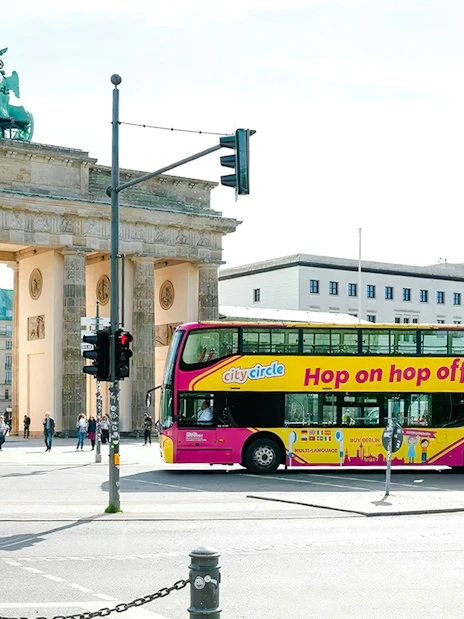 City circle bus passing by the Brandenburg Gate in Berlin.