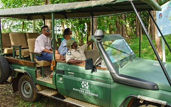 4x4 safari vehicle with tourists at Heritage Nature Reserve, Bel Ombre.