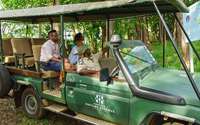 4x4 safari vehicle with tourists at Heritage Nature Reserve, Bel Ombre.