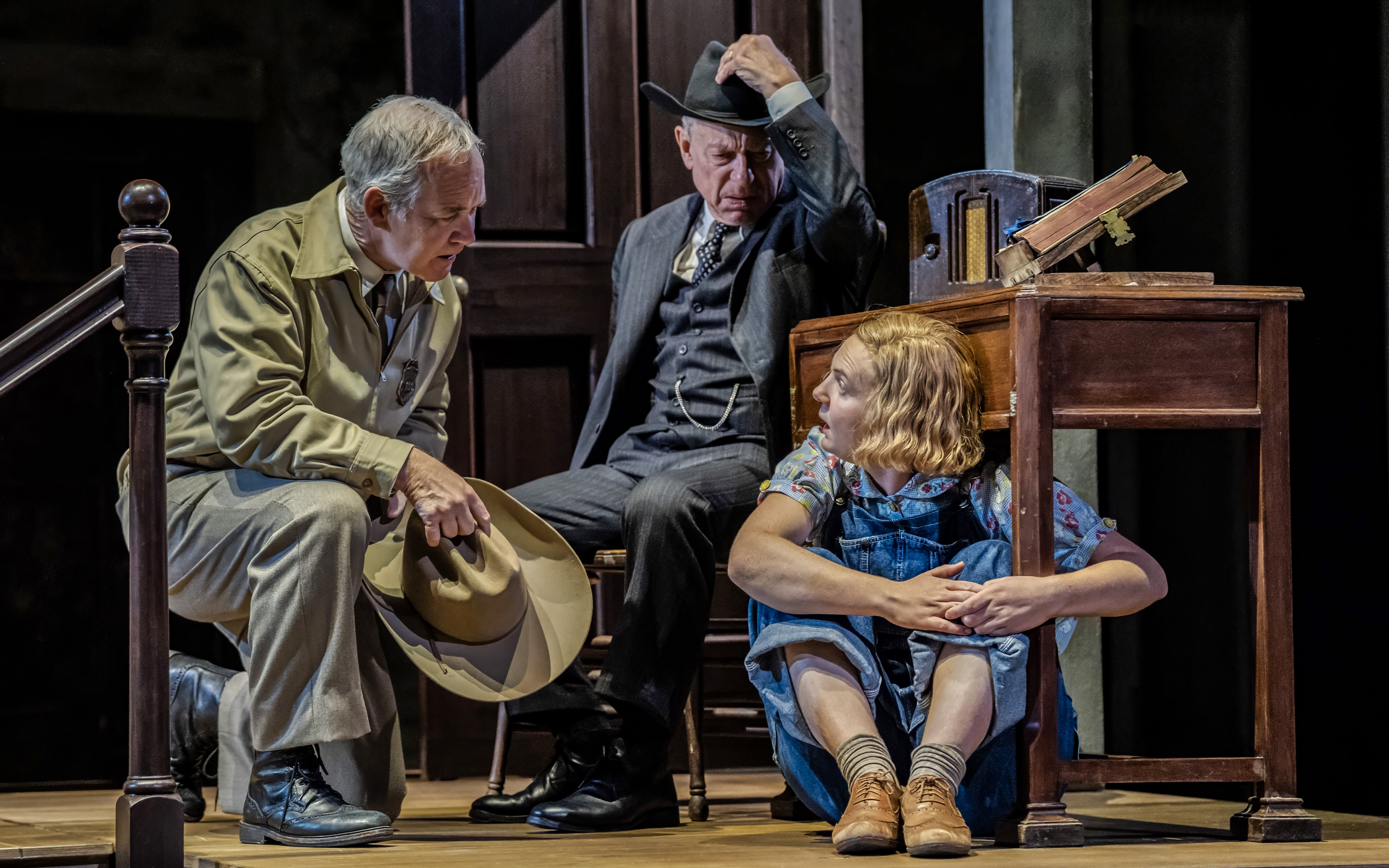 Actors performing a scene from "To Kill a Mockingbird" on a West End stage.