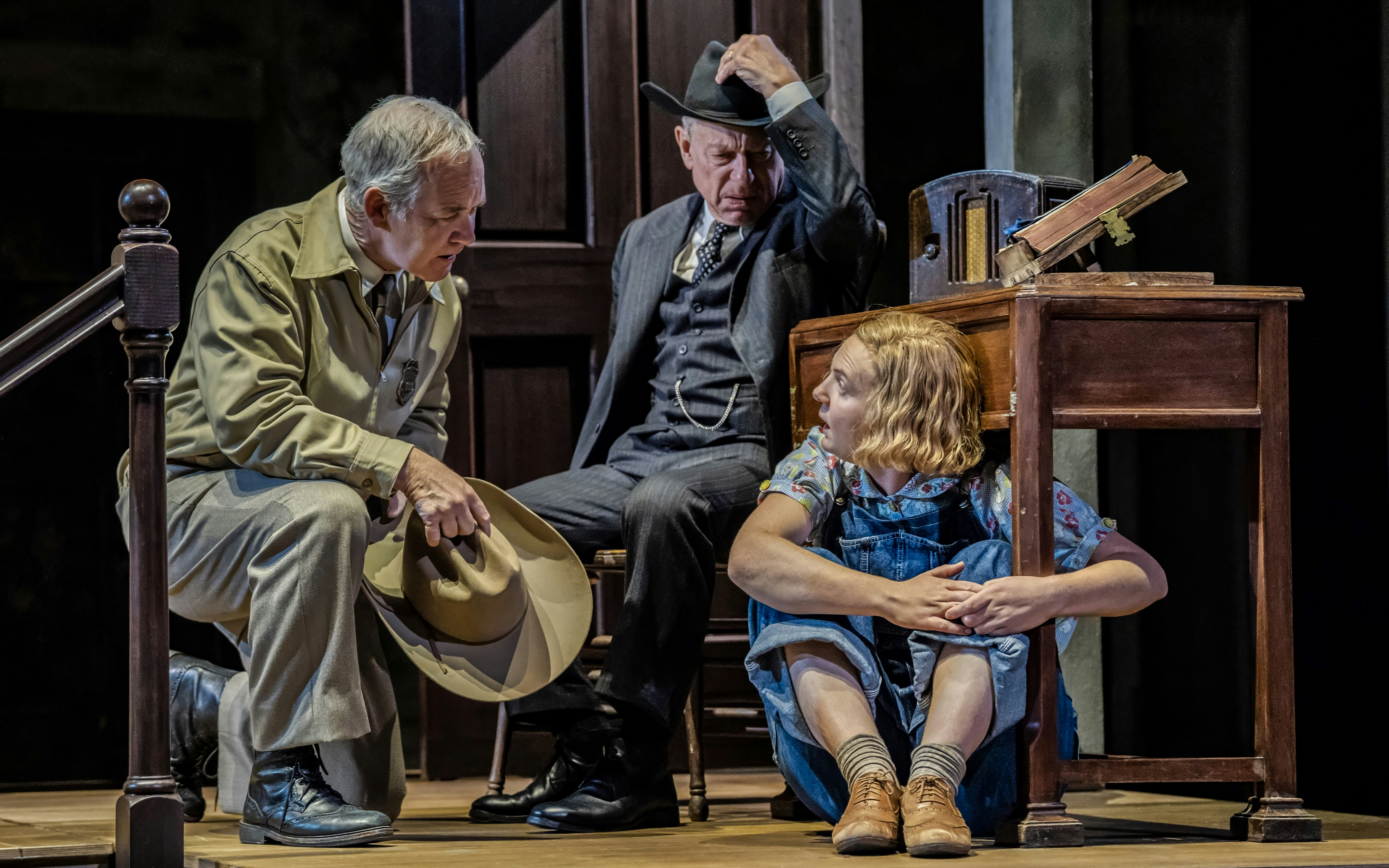 Actors performing a scene from "To Kill a Mockingbird" on a West End stage.