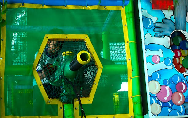 Child playing with air cannon at Jungle Gym, KL East Mall, Malaysia.