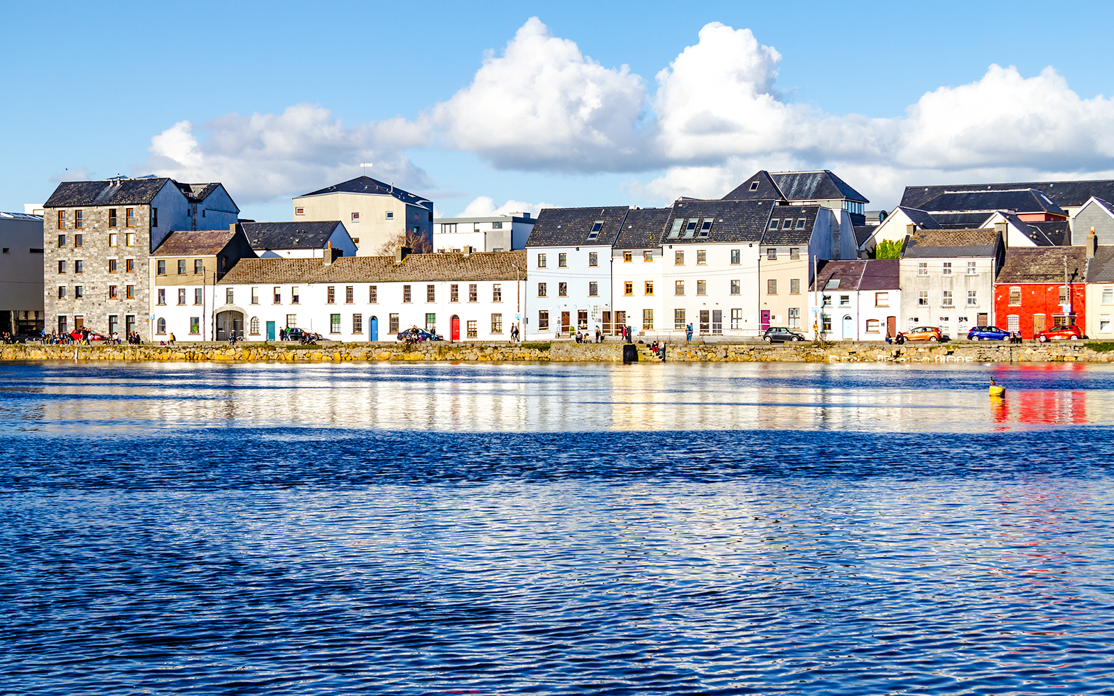 Colorful houses along the waterfront in Galway City, Ireland.