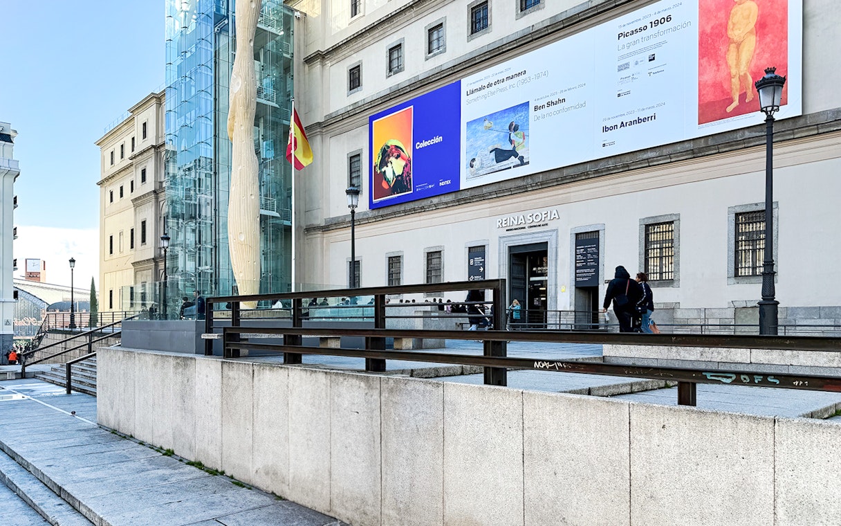 Reina Sofia Museum entrance with modern art banners in Madrid, Spain.