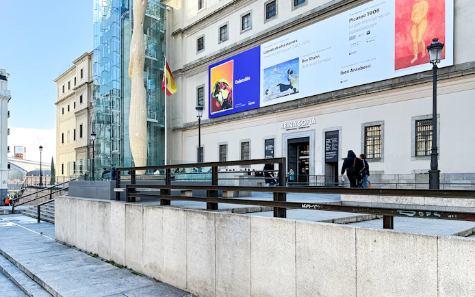 Reina Sofia Museum entrance with modern art banners in Madrid, Spain.