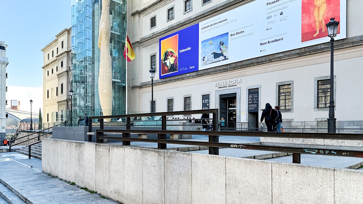 Visitors exploring the modern art exhibits at the Reina Sofia Museum in Madrid, Spain