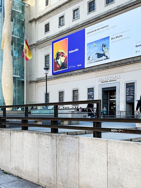 Reina Sofia Museum entrance with modern art banners in Madrid, Spain.