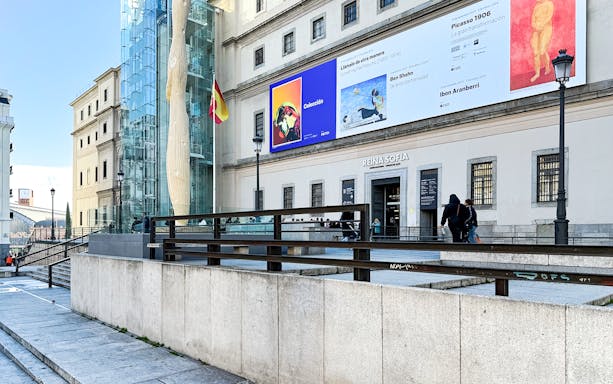 Reina Sofia Museum entrance with modern art banners in Madrid, Spain.