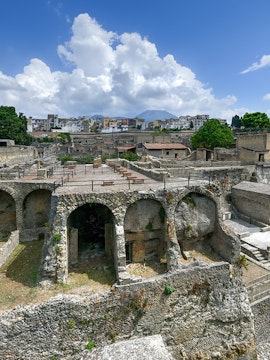 Ancient ruins of Herculaneum with Mount Vesuvius in the background, Italy.