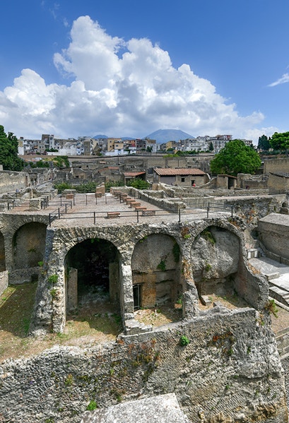 Ancient ruins of Herculaneum with Mount Vesuvius in the background, Italy.