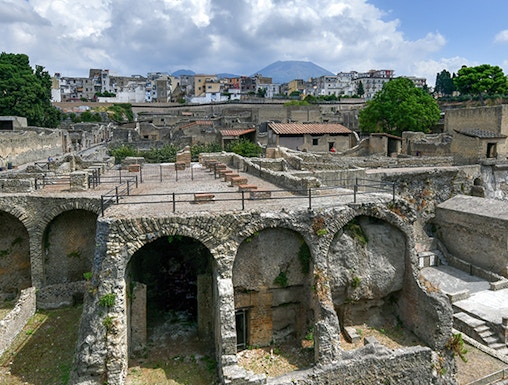 Ancient ruins of Herculaneum with Mount Vesuvius in the background, Italy.