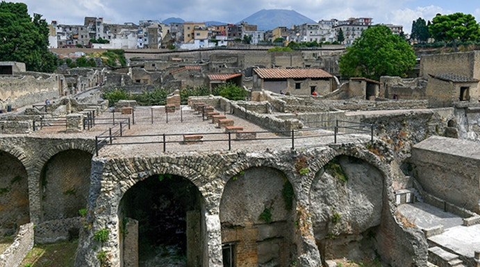 Ancient ruins of Herculaneum with Mount Vesuvius in the background, Italy.