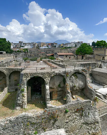 Ancient ruins of Herculaneum with Mount Vesuvius in the background, Italy.