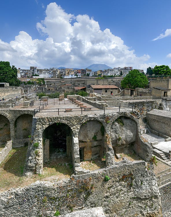 Ancient ruins of Herculaneum with Mount Vesuvius in the background, Italy.