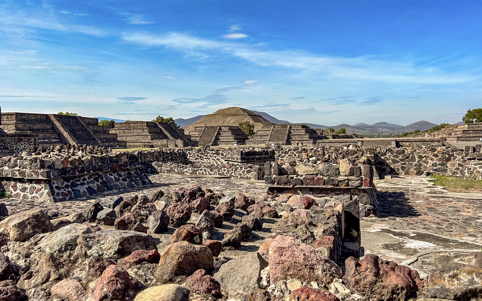 Ruins with Pyramid of the Sun in background, Teotihuacan, Mexico.