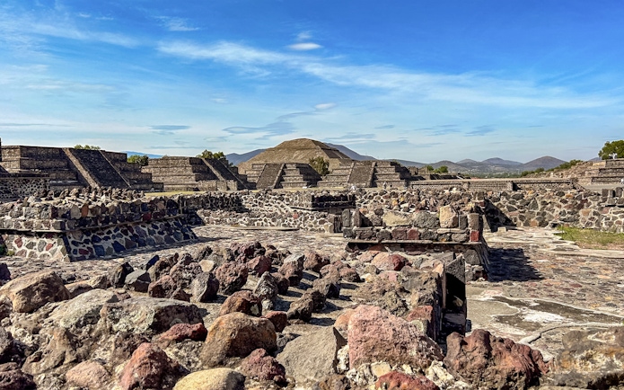 Ruins with Pyramid of the Sun in background, Teotihuacan, Mexico.