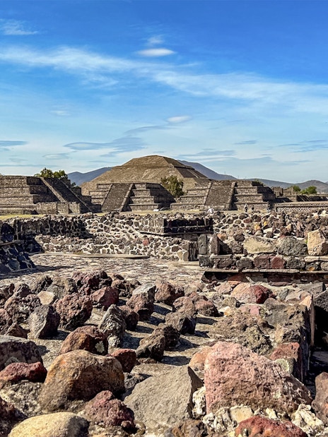 Ruins with Pyramid of the Sun in background, Teotihuacan, Mexico.