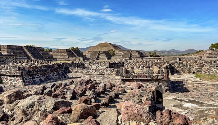 Ruins with Pyramid of the Sun in background, Teotihuacan, Mexico.