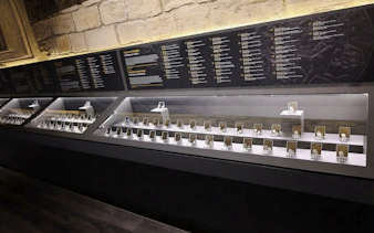 Coins displayed in glass cases at the Museum of Numismatics, Baku guided tour.