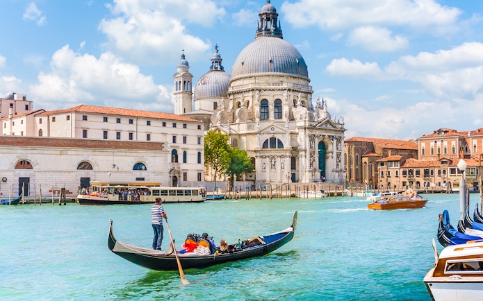 Gondola on Venice canal near St. Mark's Basilica during guided tour.