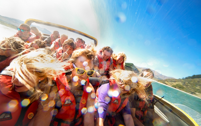 Guests on a jet boat ride on Kawarau and Shotover Rivers, New Zealand.