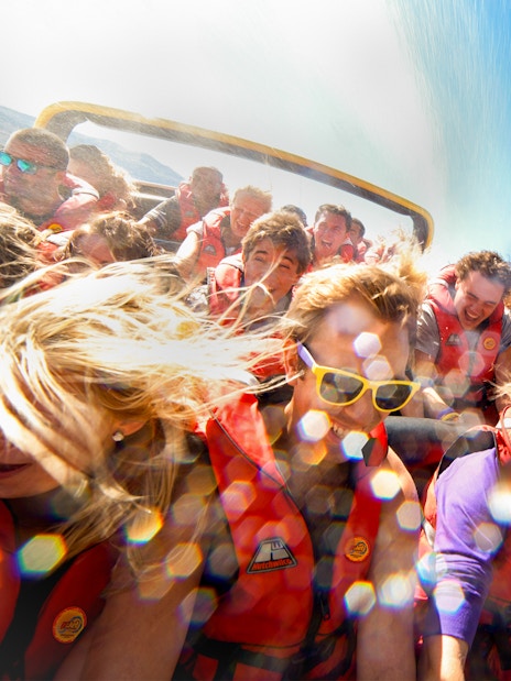 Guests on a jet boat ride on Kawarau and Shotover Rivers, New Zealand.
