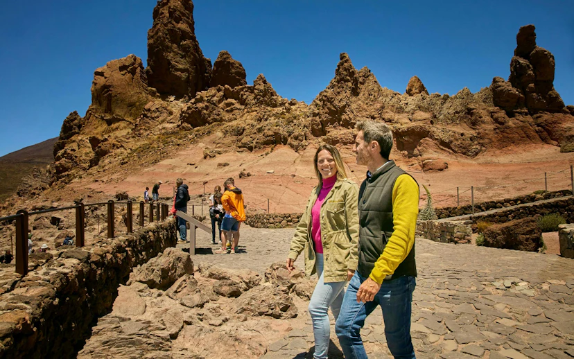 Guests walking on Mount Teide guided tour with rocky landscape in Tenerife.