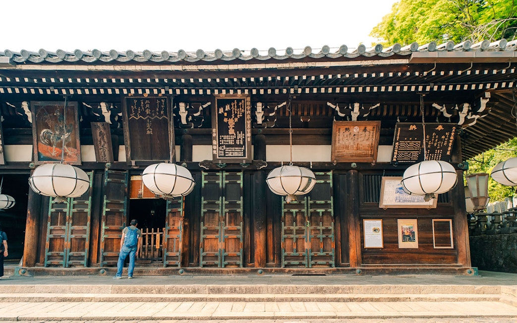 Tōdai-ji Temple entrance with traditional lanterns and wooden architecture in Nara, Japan.