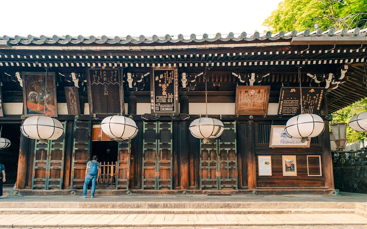Tōdai-ji Temple entrance with traditional lanterns and wooden architecture in Nara, Japan.