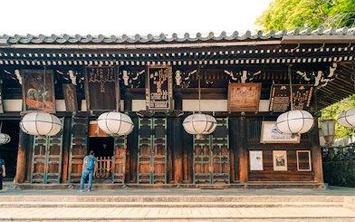 Tōdai-ji Temple entrance with traditional lanterns and wooden architecture in Nara, Japan.