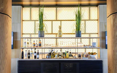 Bar area with drinks and snacks at Primeclass Lounge, Zurich Airport Terminal E.