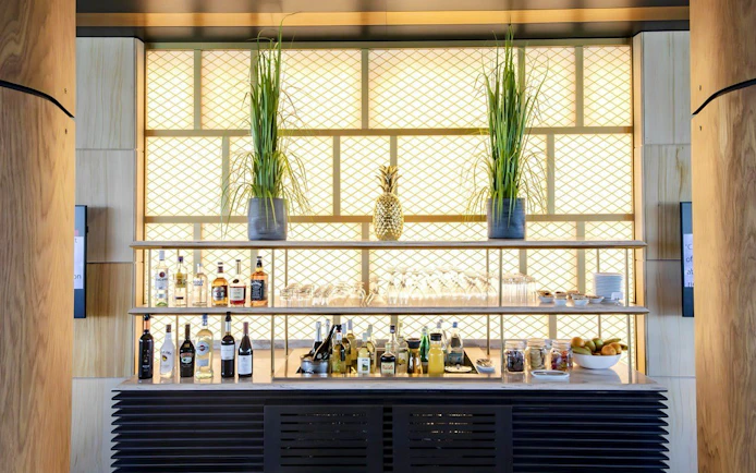 Bar area with drinks and snacks at Primeclass Lounge, Zurich Airport Terminal E.