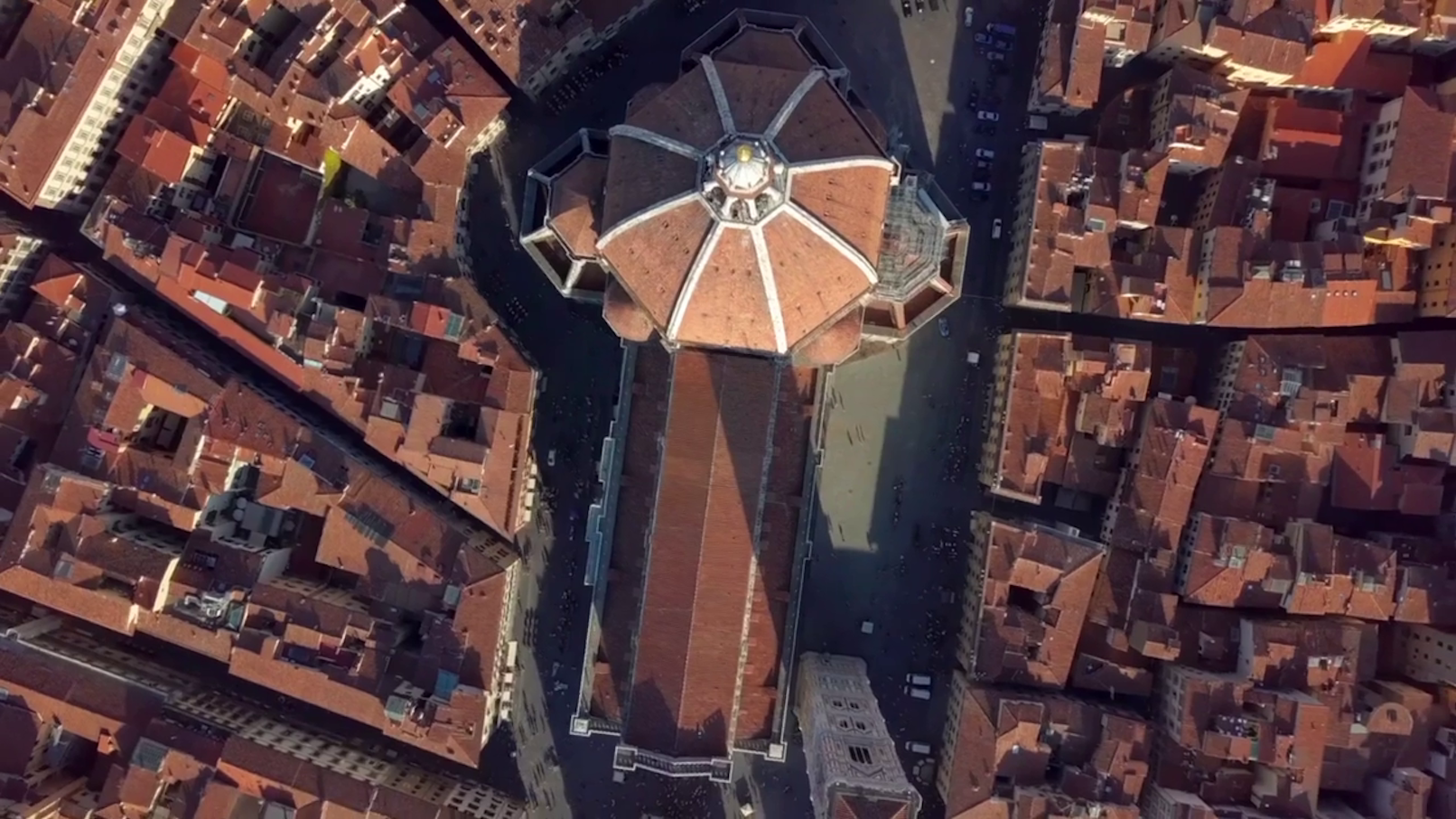 Gondolas on Venice's Grand Canal with historic buildings in the background.