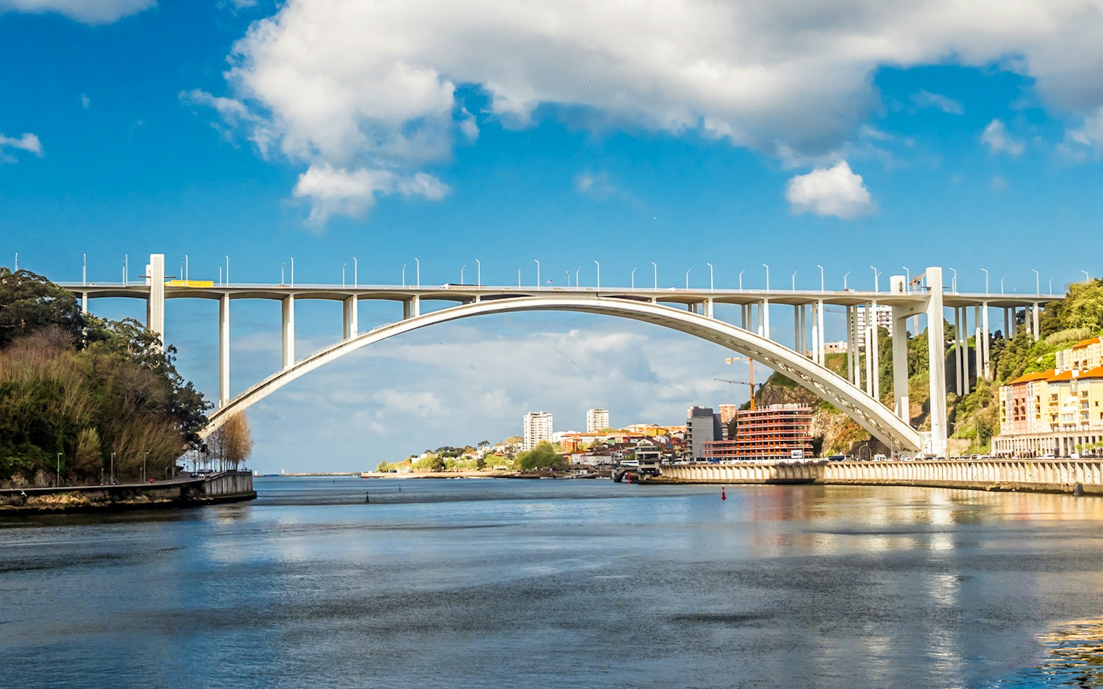 Arrábida Bridge spanning the Douro River in Porto, Portugal.