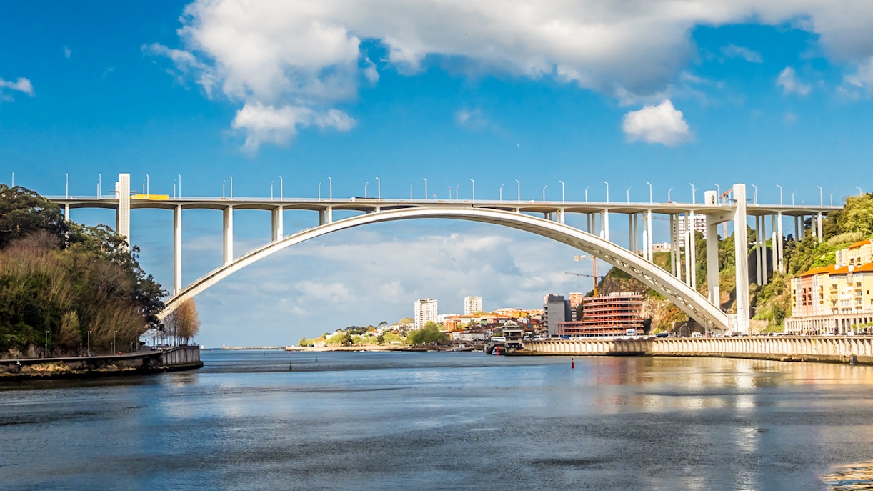 Arrábida Bridge spanning the Douro River in Porto, Portugal.